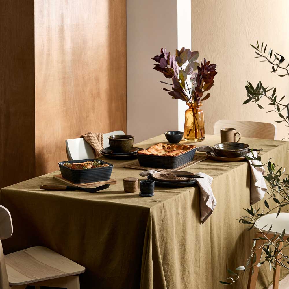 dining table with moody ribbed rustic dinnerware, bakeware, and kitchenware - MyHouse