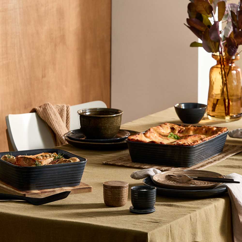 dining table with moody ribbed rustic dinnerware, bakeware, and kitchenware - MyHouse