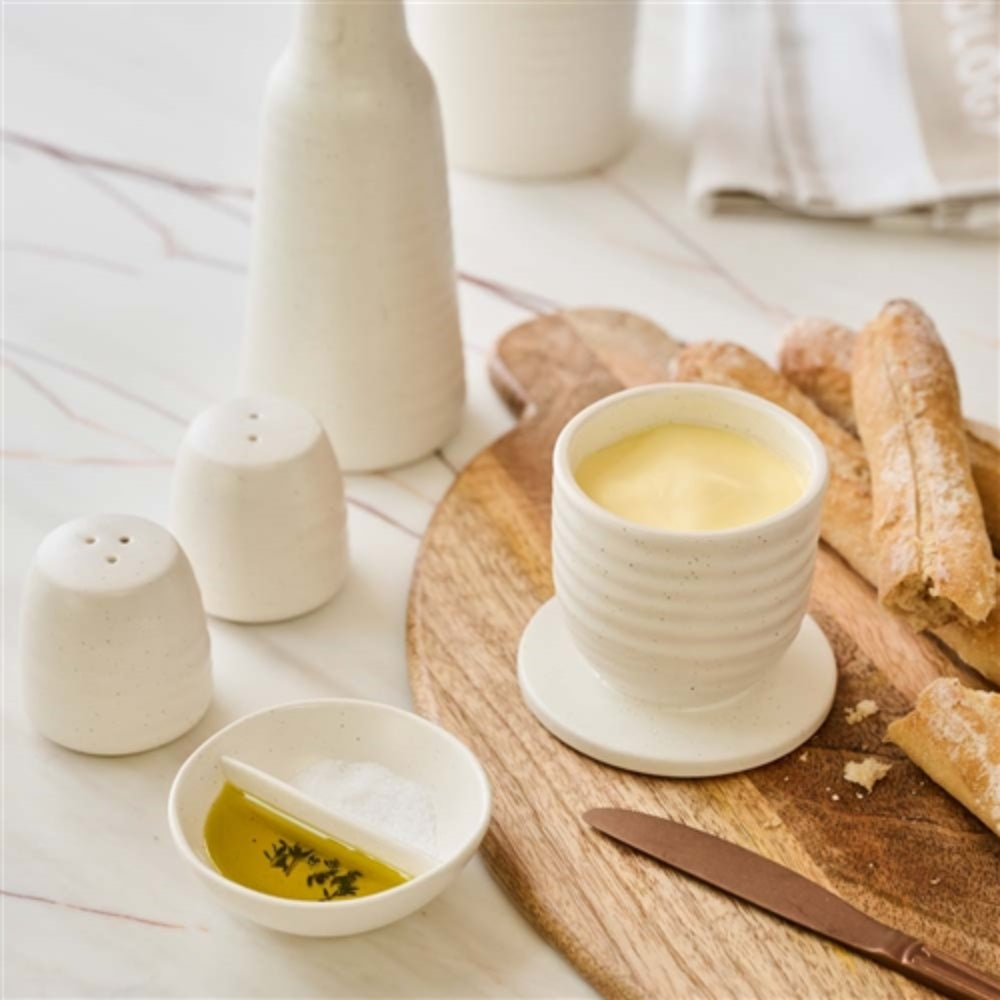 Salt and olive oil in the Ecology ottawa salt dish with bread and butter ready to serve.