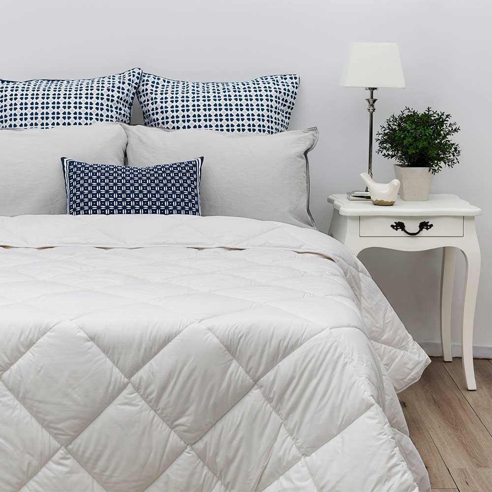 Tontine Farmhouse Lightweight Washable Wool Quilt on a bed at MyHouse