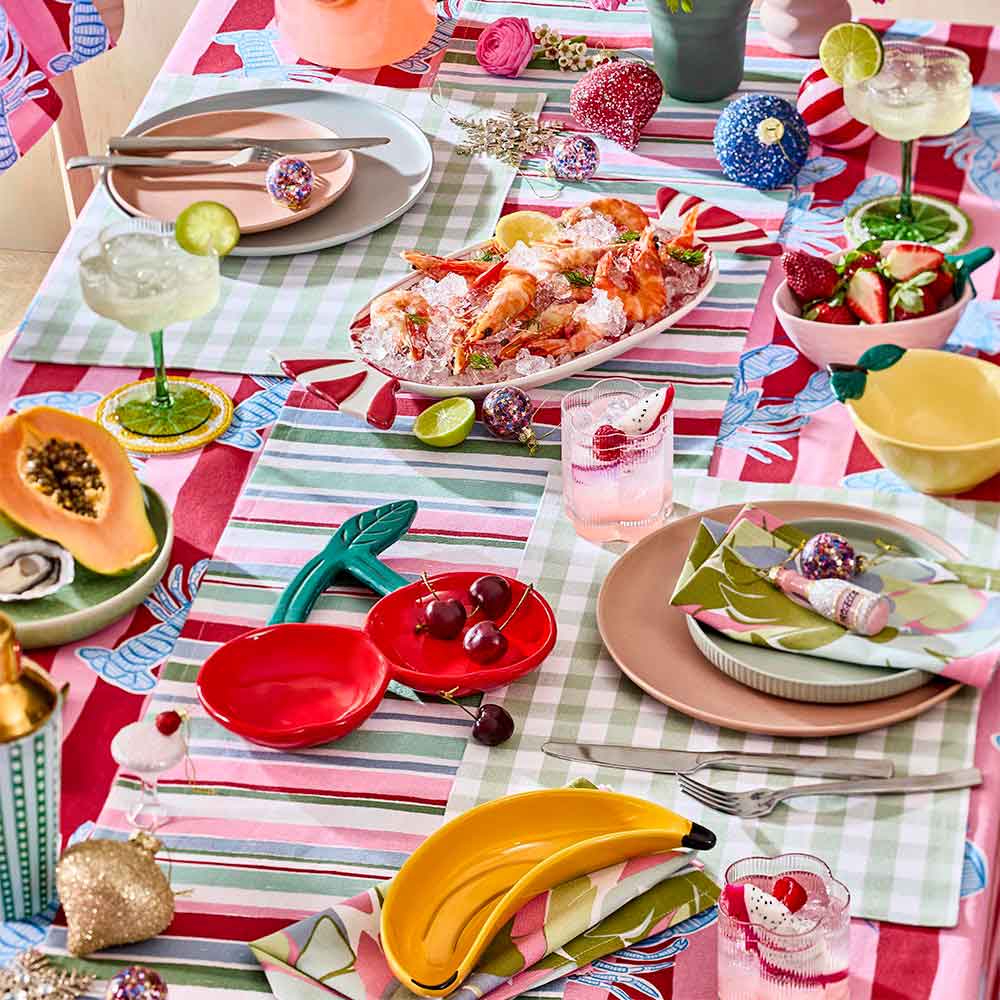 calypso tropical inspired outdoor dining table setup
