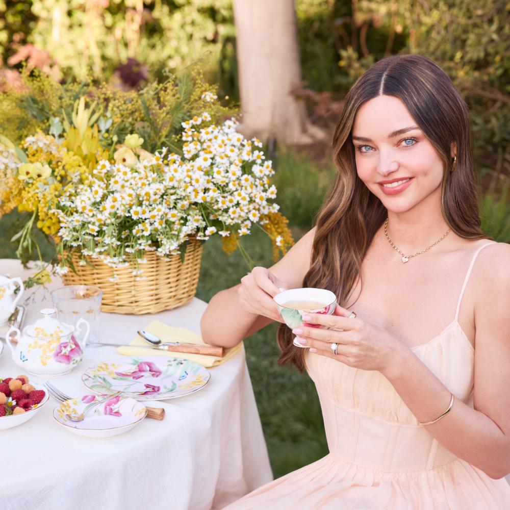 Miranda Kerr drinking tea outside