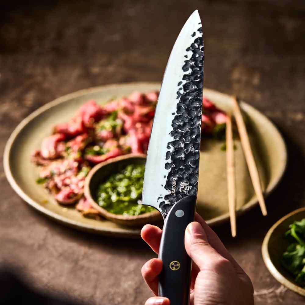 Man holding Baccarat KUROI KIBA Chefs Knife 20cm at MyHouse