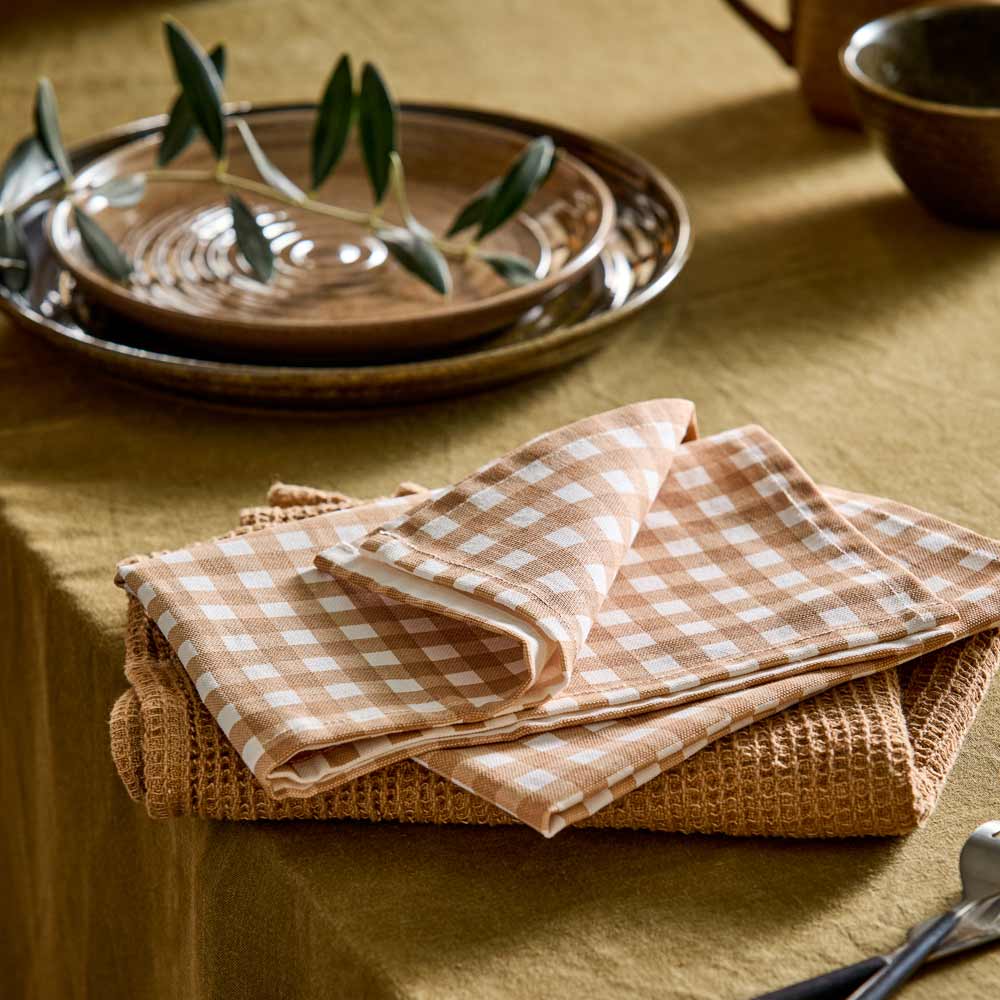 beige check tea towel and beige waffle tea towel on dining table - MyHouse