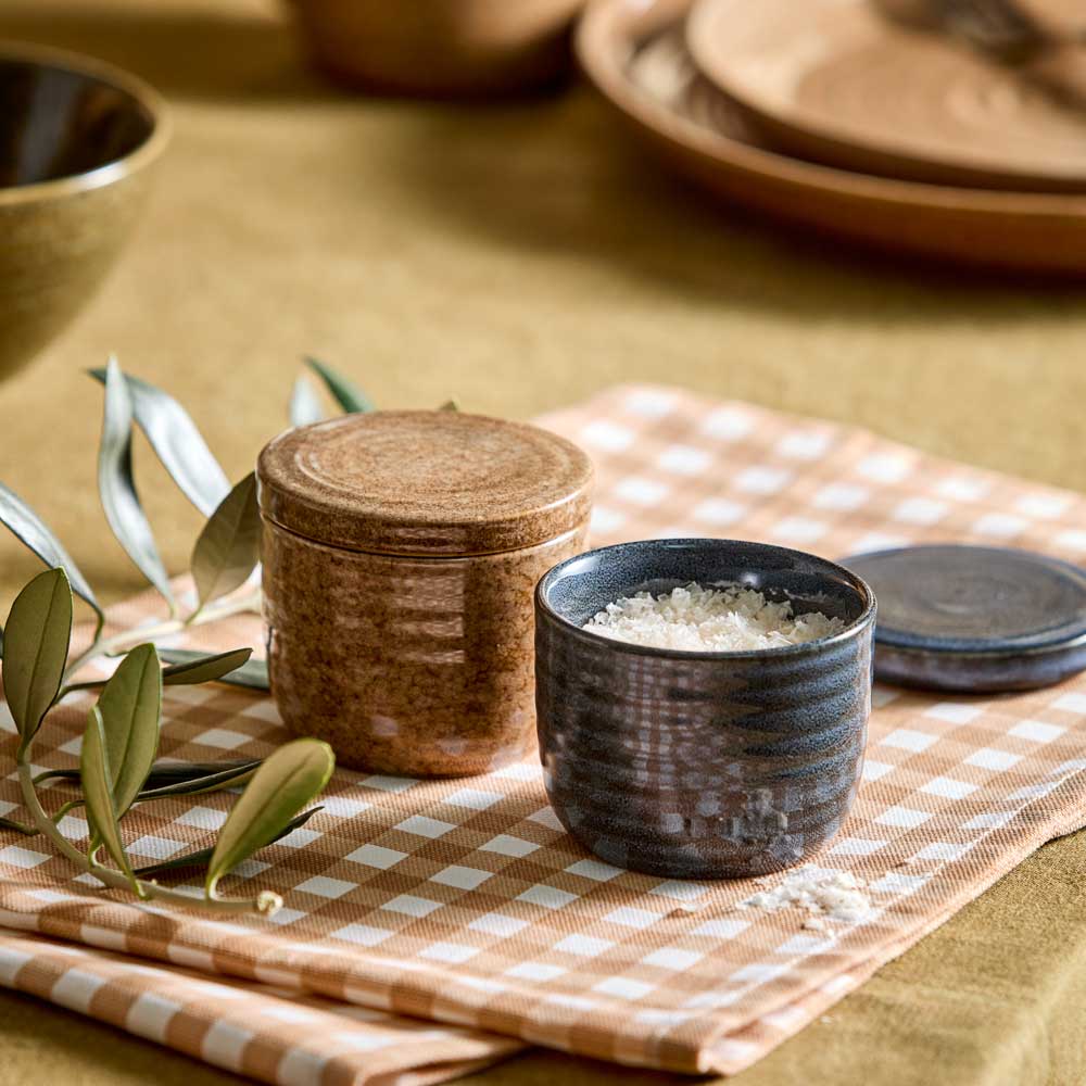 Salt And Pepper Pinch Pots in navy and brown sitting on a beige check tea towel - MyHouse