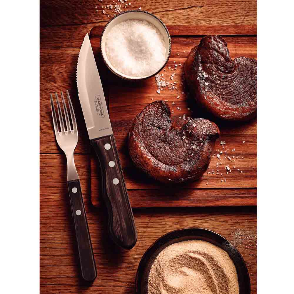 steak knife and fork set with side of steaks on wooden board - MyHouse