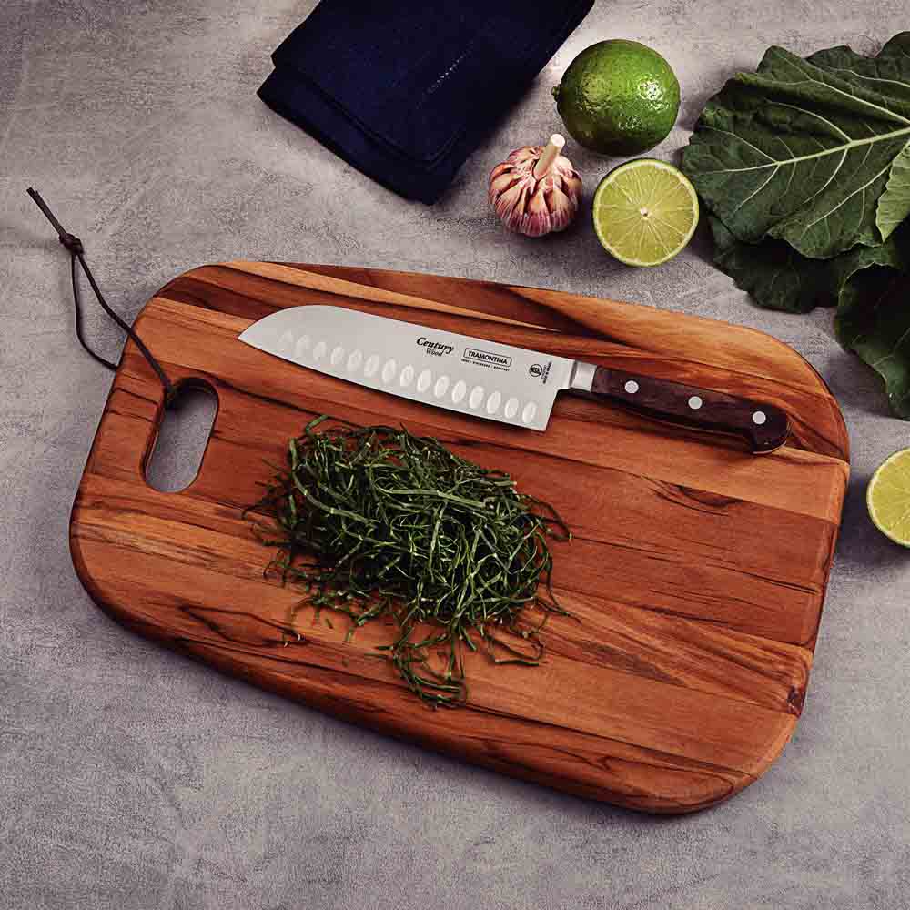 Santoku Knifeon wooden board with sliced vegetables- MyHouse