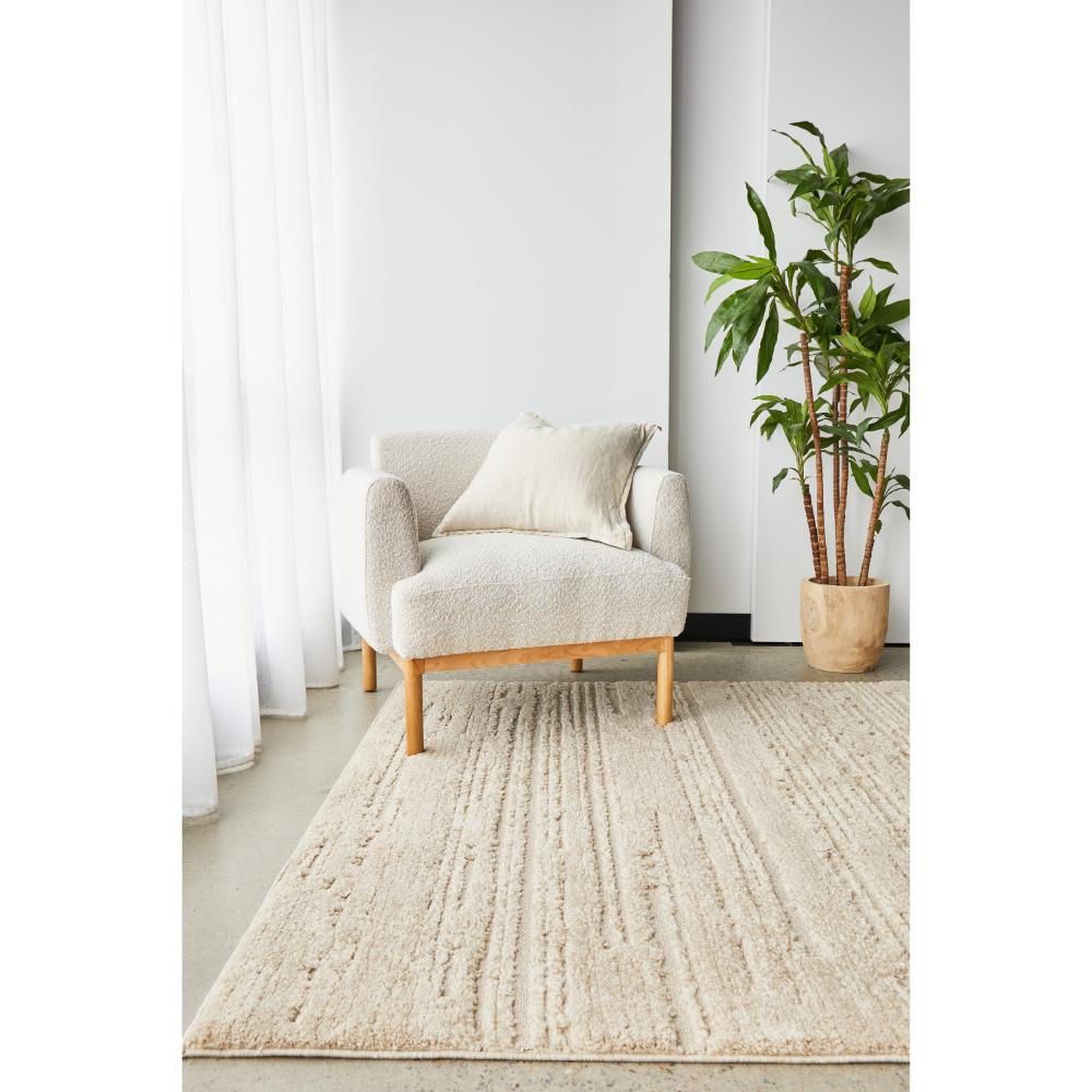 Rug Culture Serenade Ezra Rug Natural with cream boucle chair at MyHouse
