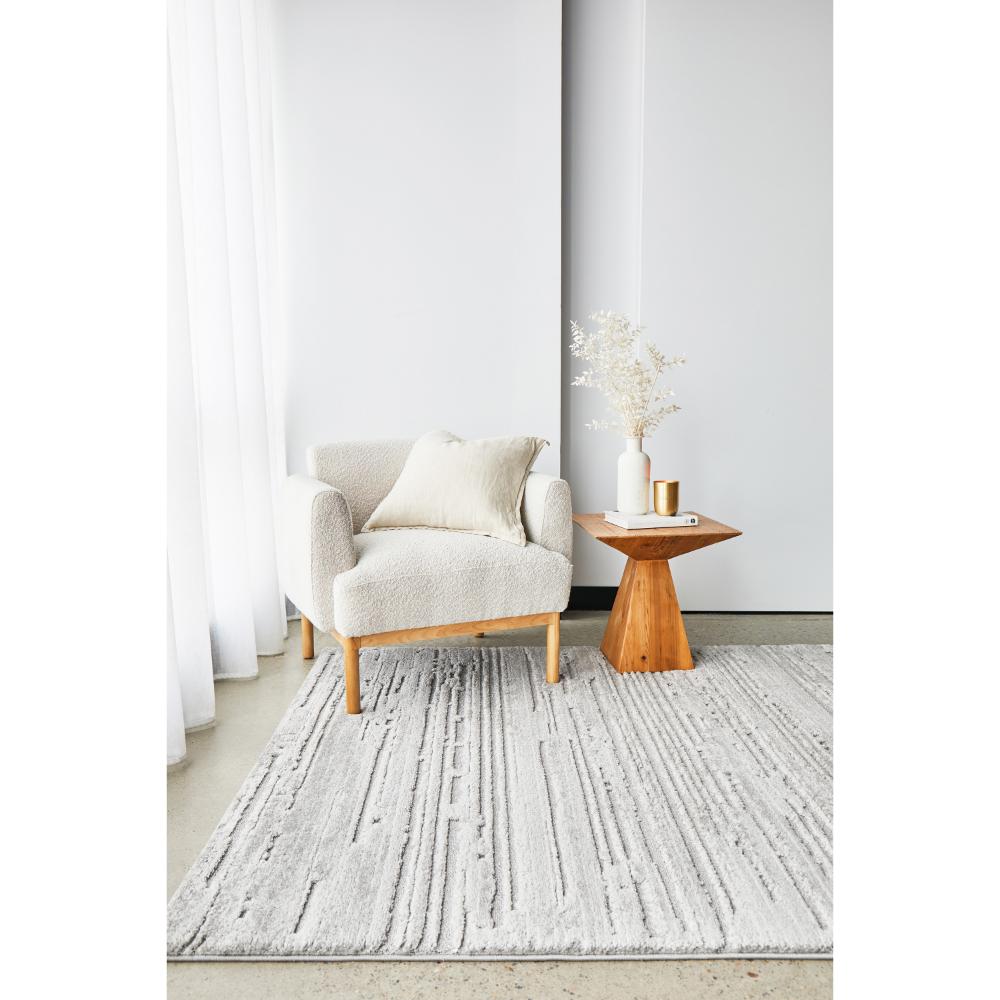 Rug Culture Serenade Ezra Rug Silver with cream chair and side table at MyHouse