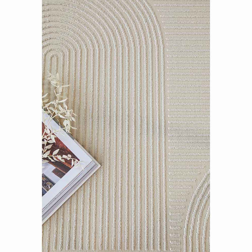 Darren Palmer Raking Rug Linen Cream with a magazine at MyHouse