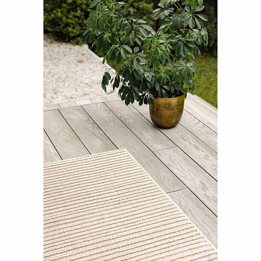 Darren Palmer Sandridge Indoor/Outdoor Rug in Taupe on outdoor patio at MyHouse