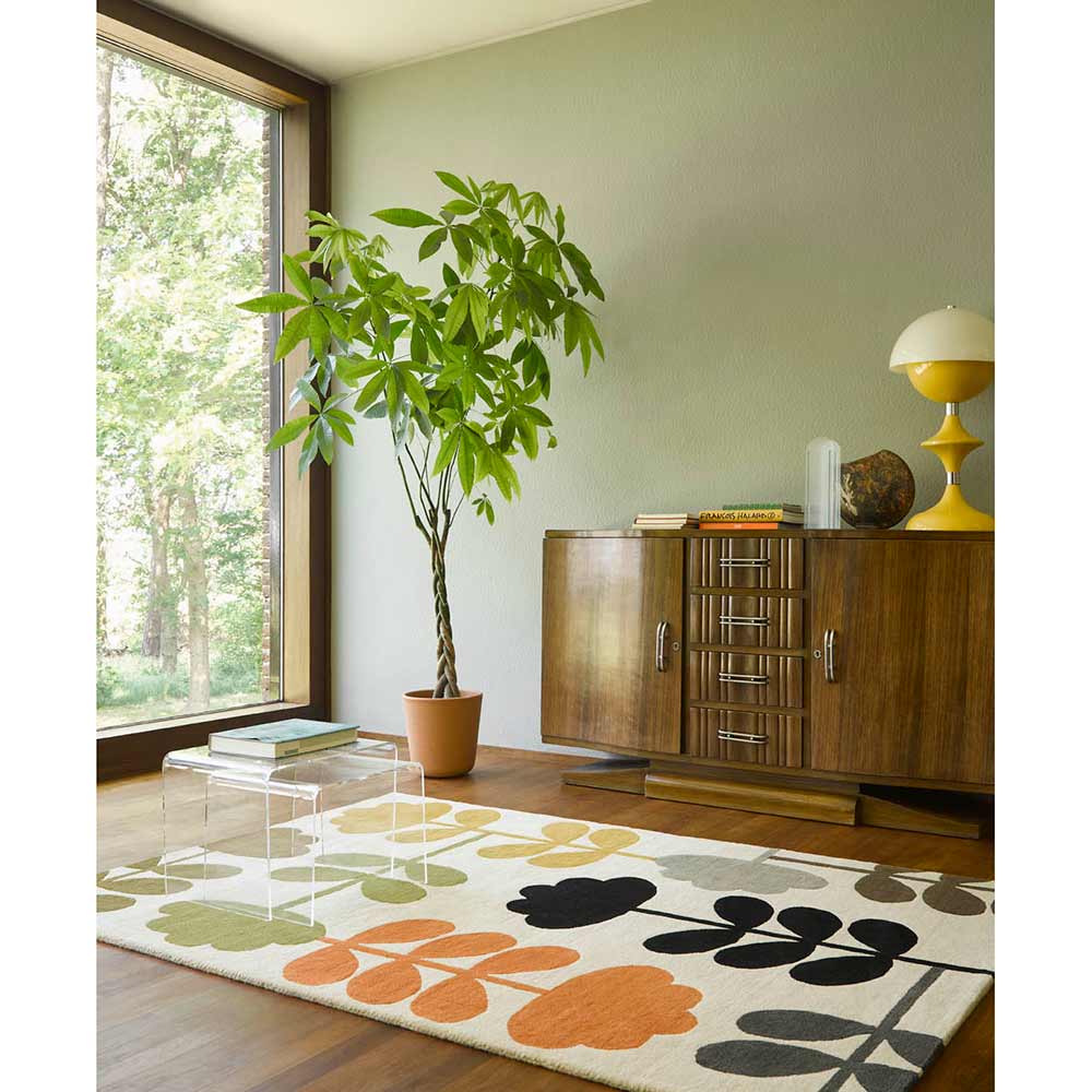 Multicolour flower wool rug in green room with big window - MyHouse