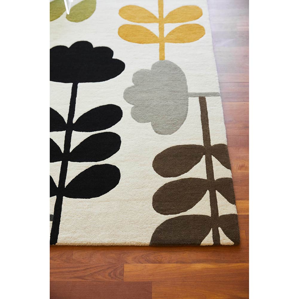 Multicolour flower wool rug on wooden floors - MyHouse