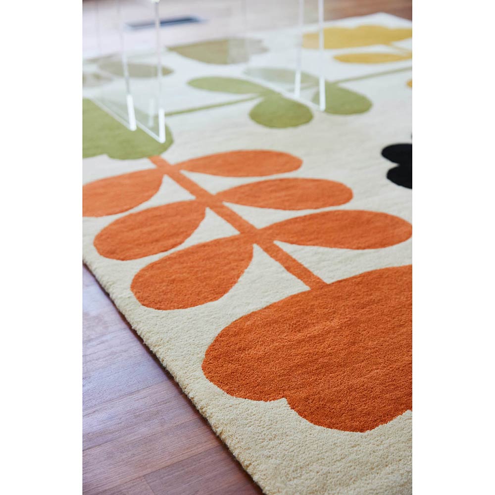 Multicolour flower wool rug on wooden floors - MyHouse