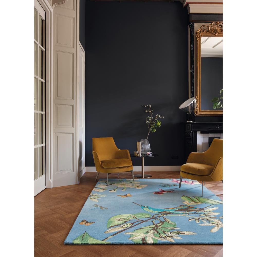 Hummingbird and floral blue wool rug in loungeroom - MyHouse