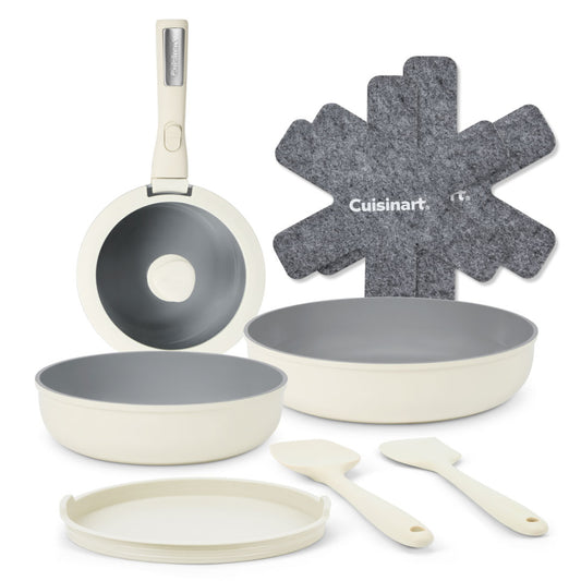 Cuisinart cookware set showing a frying pan, two skillets, 1 8 inch and one 12 inch, a storage lid and two stirring spoons.