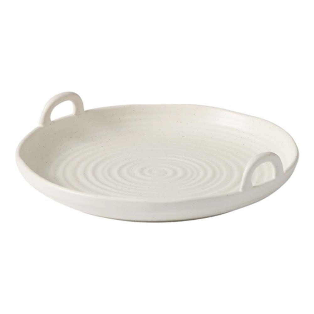 A textured finish, shallow serving bowl with side handles for easy carrying and serving.