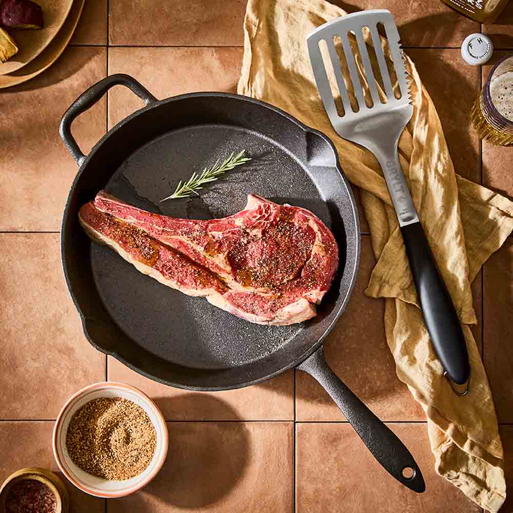 steak in a cast iron frypan with helper handle - MyHouse