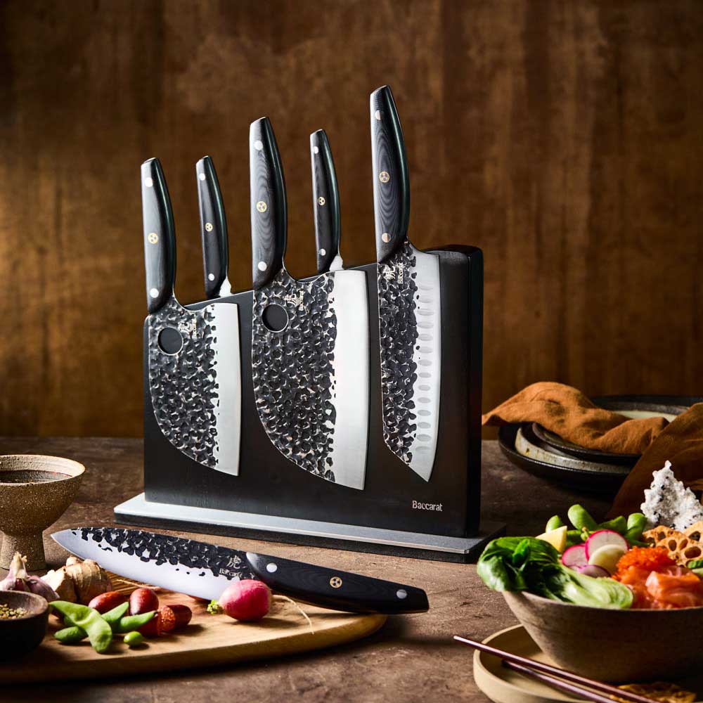 Baccarat KUROI KIBA 7 Piece Knife Block on wooden bench with vegetables at MyHouse