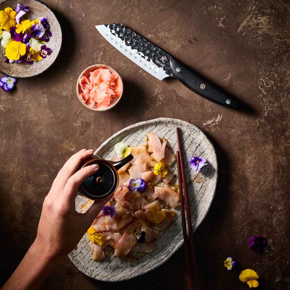 Woman pouring sauce on sashimi - Baccarat KUROI KIBA Santoku Knife 14cm at MyHouse