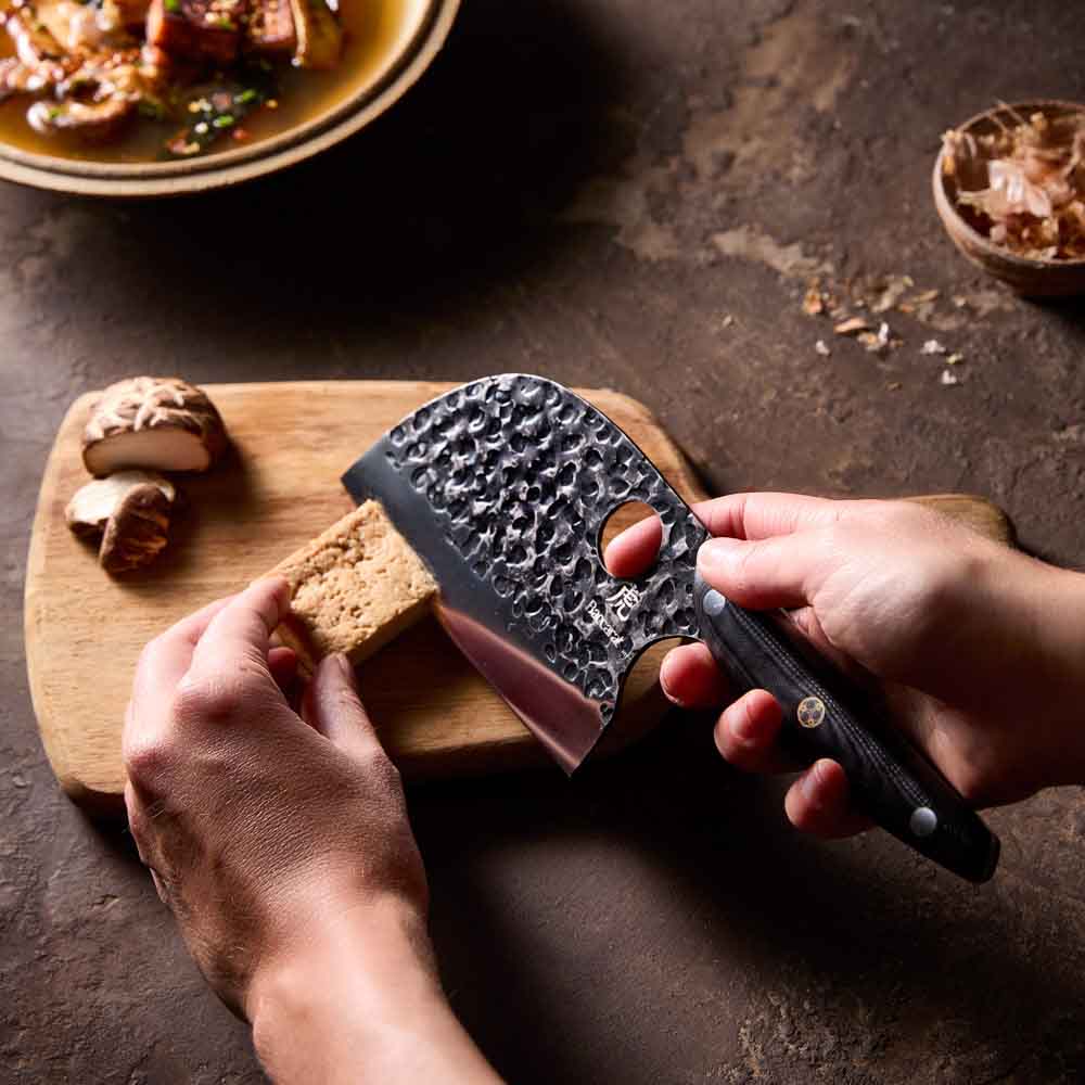 Woman slicing tofu with Baccarat KUROI KIBA Moon Knife 12.5cm at MyHouse