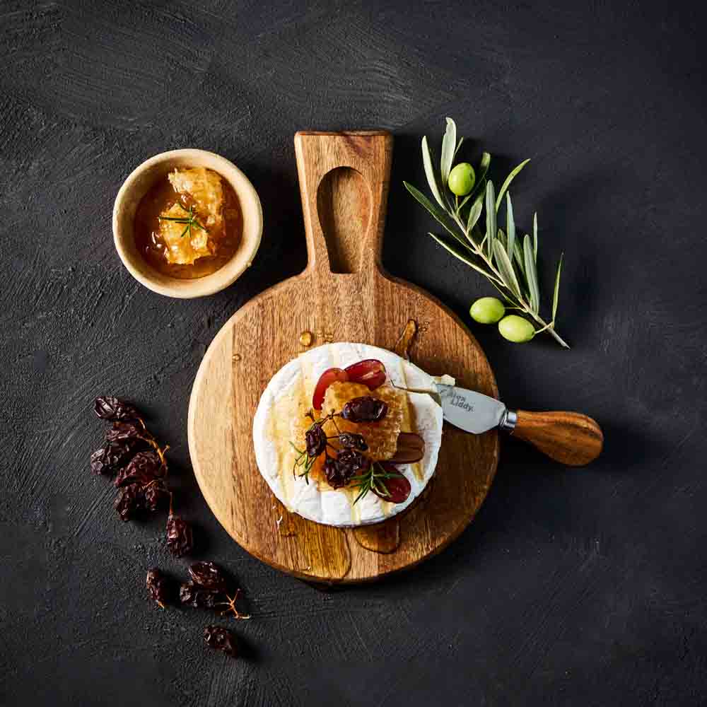 brie and honey with cheese knife on cheese board - MyHouse