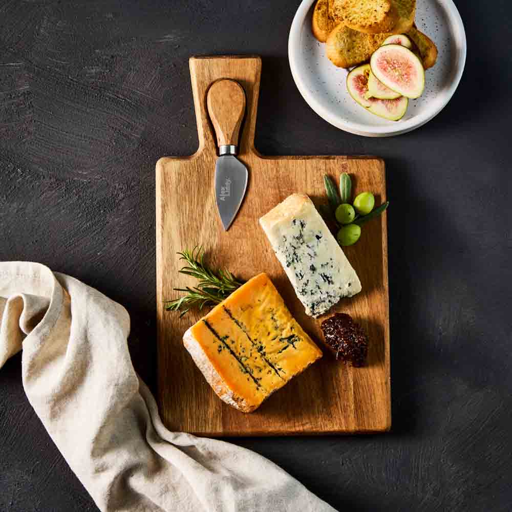 quince paste and cheese on cheese board with knife - MyHouse