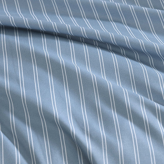 Blue fabric with white pinstripes on a white background