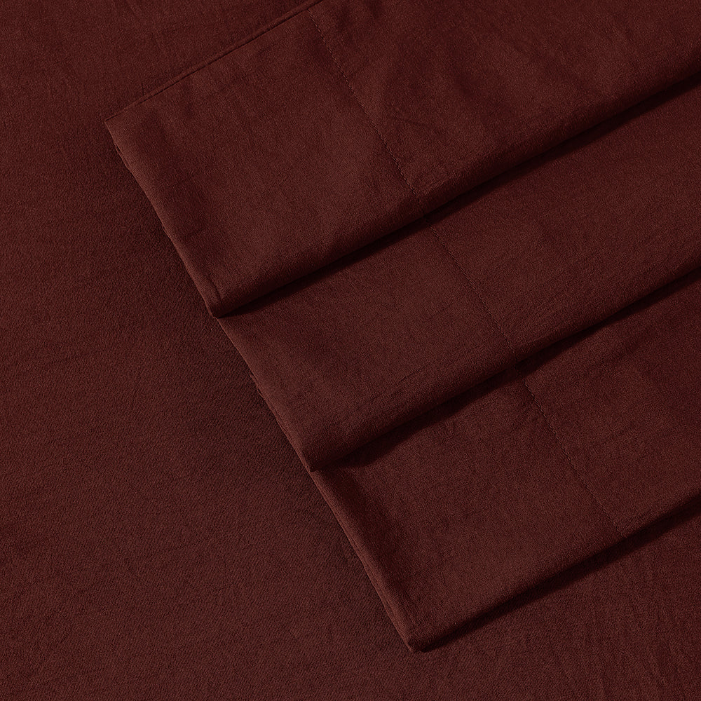 Close-up of Ardor Boudoir Vintage Washed rust sheet set fabric showcasing washed texture