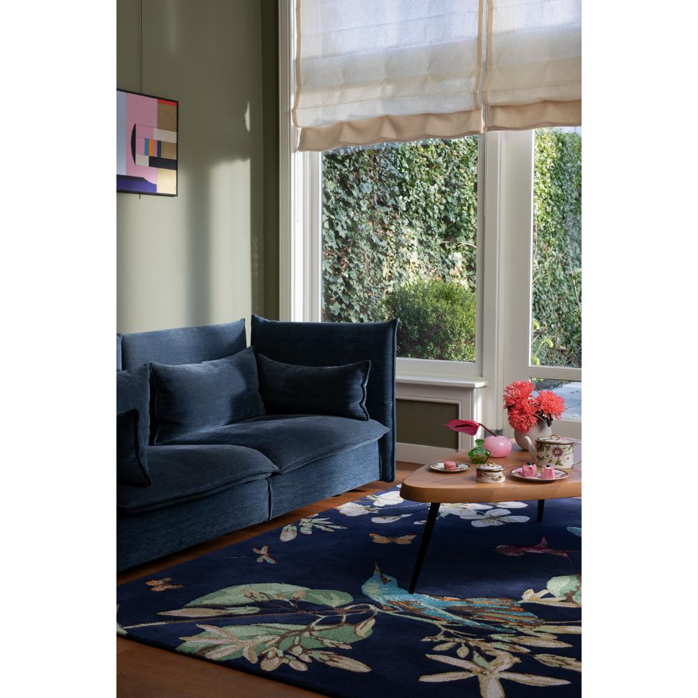 Hummingbird and floral blue wool rug in loungeroom - MyHouse