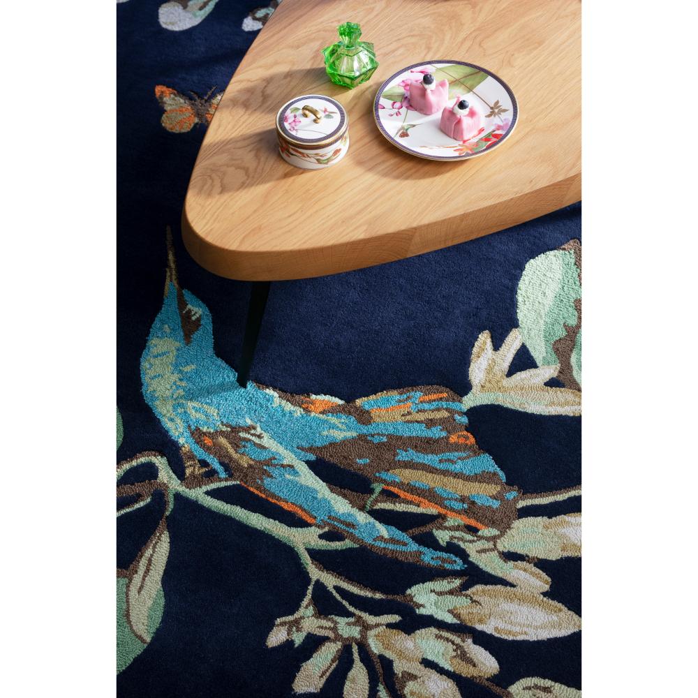 Hummingbird and floral blue wool rug with coffee table - MyHouse